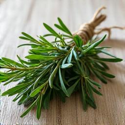 Faisceau d'herbes aromatiques fraîches comme le romarin et le thym, attachées avec de la ficelle.
